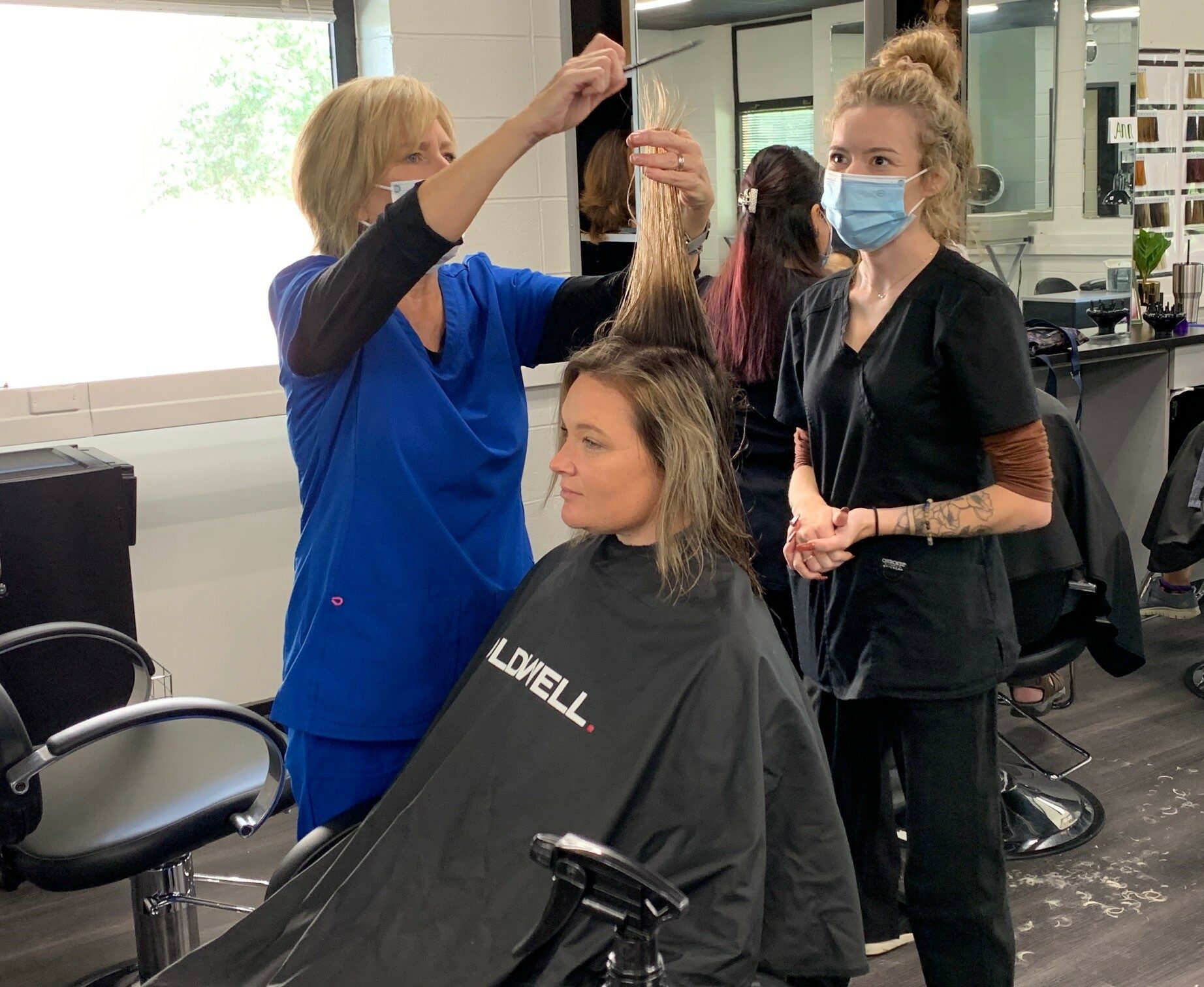 instructor demonstrating haircut